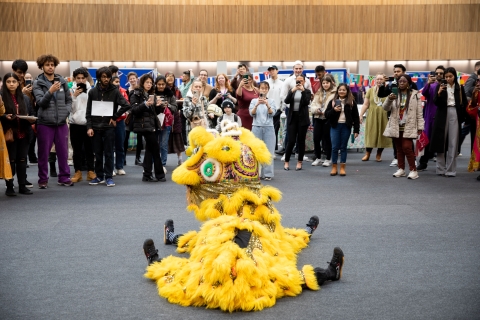dragon at festival of cultures surrounded by people