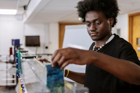 Male student using triangular measuring container
Technology Facilities Day One